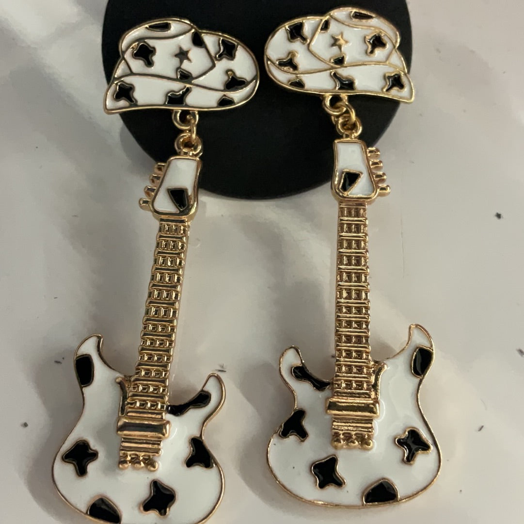 White and black guitar and cowgirl hat dangle earrings with gold-tone accents by Crystal Avenue