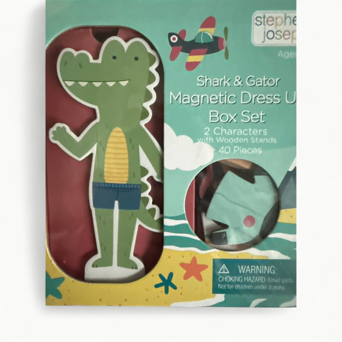 Magnetic dress-up set with flip-top cardboard case, three magnetic sheets, shark and gator character themes