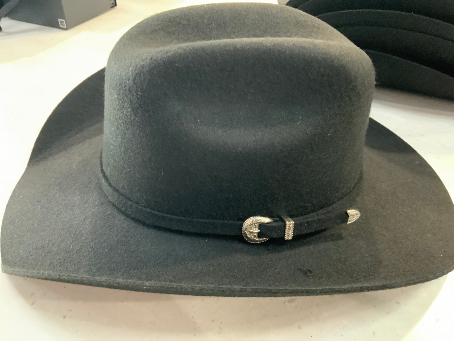 Black wool felt cowboy hat with silver buckle trim by JR Palacios