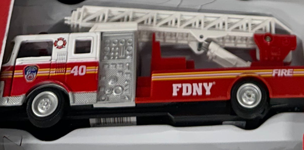 Red and white pullback FDNY Ladder Truck die-cast model by Daron with realistic proportions