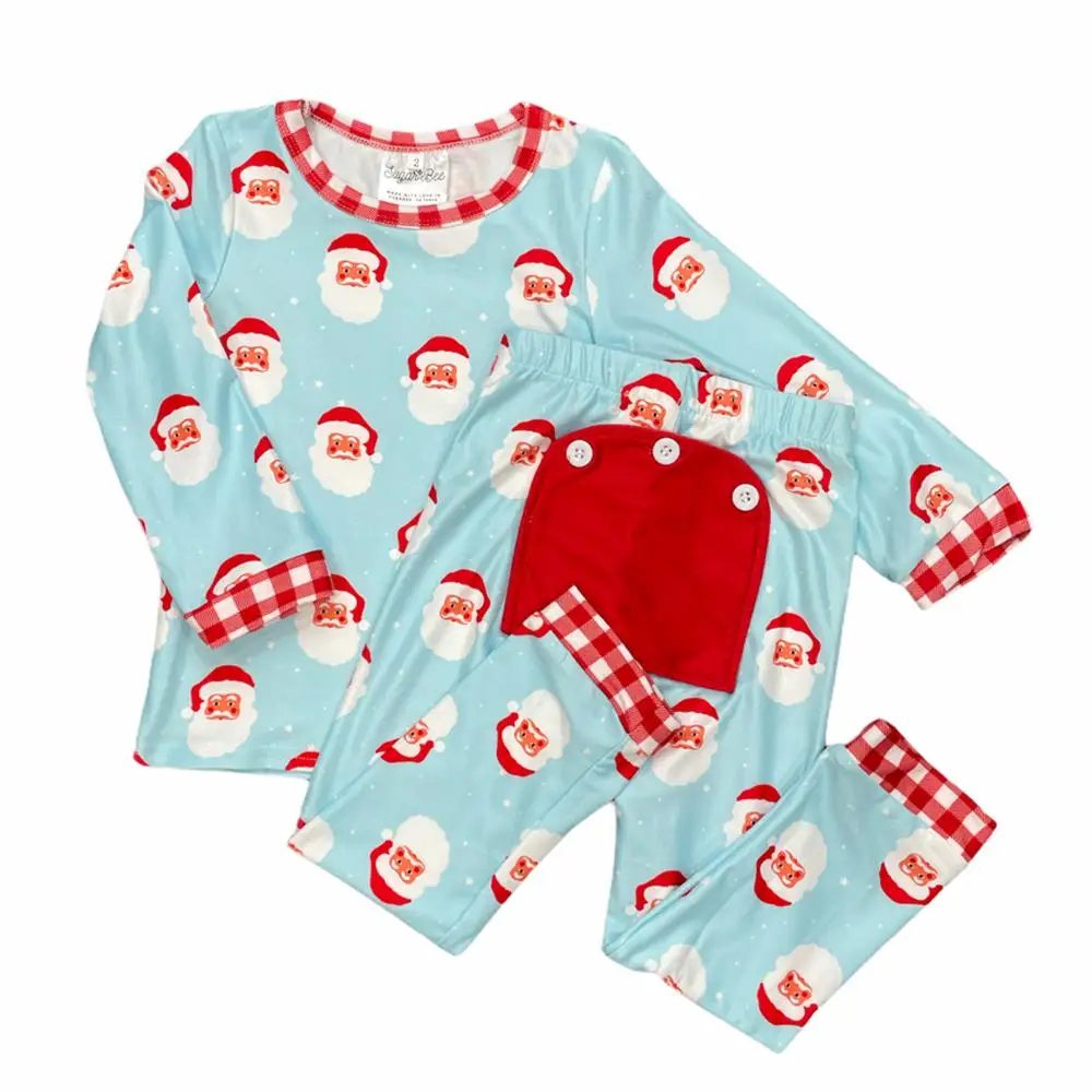 Santa buttflap pajamas in aqua with white stars, red gingham trim, and drop-seat detail by Sugar Bee Clothing
