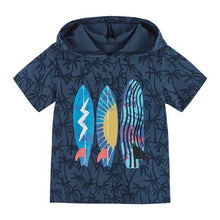 Load image into Gallery viewer, Navy blue short-sleeved hooded t-shirt with dark navy palm tree pattern. The front features three brightly colored surfboards.