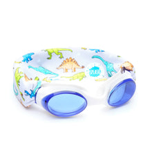 Load image into Gallery viewer, Our dino swim goggle features our tangle-free, patent-pending strap in a colorful dinosaur print with a light grey background, paired with a white frame and lightly tinted gray lenses. One size fits kids to adults. Ages 3+. No more pulled or tangled hair. Fun, fashionable, comfortable. High visibility, anti-fog lenses. Shatter resistant polycarbonate lenses. Hypoallergenic—latex & pvc free. Sensory friendly.