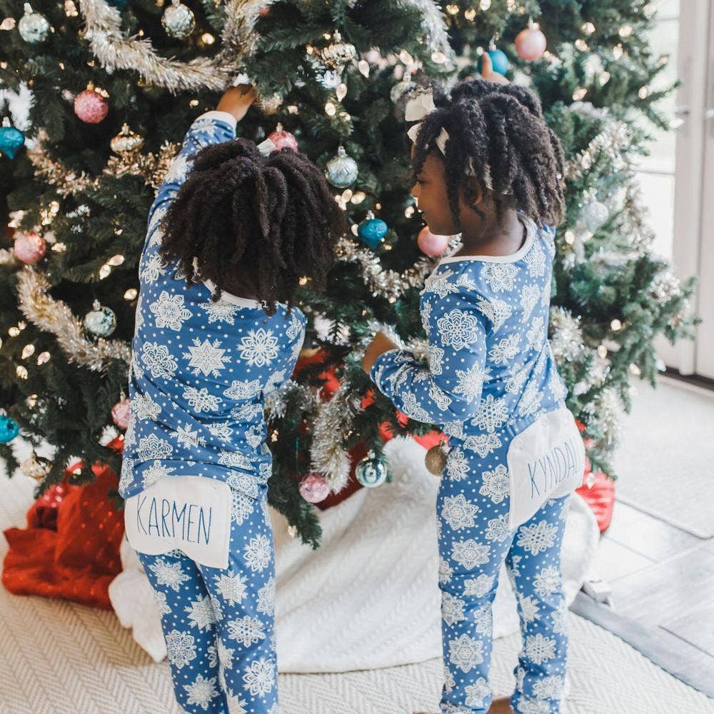 Snowflakes Buttflap Pajamas in blue with white snowflake pattern by Sugar Bee Clothing