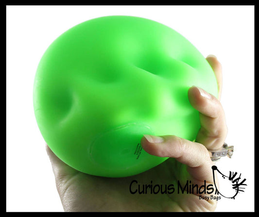 Jumbo 4-inch Nee Doh stress stretch ball in neutral tone, soft and moldable fidget toy