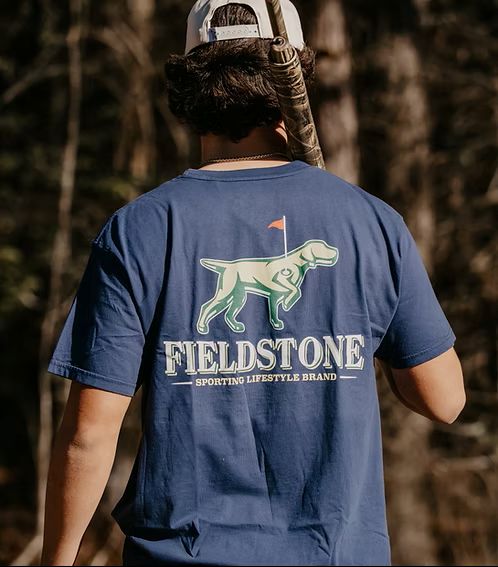 Navy short-sleeve tee with subtle Fieldstone logo pin detail, ringspun cotton.