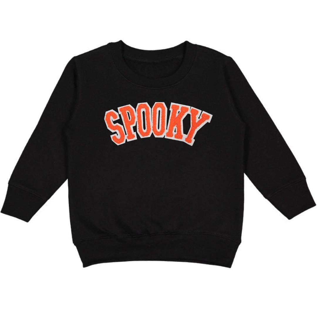 Black crewneck sweatshirt with orange chenille patch and white felt outline detail