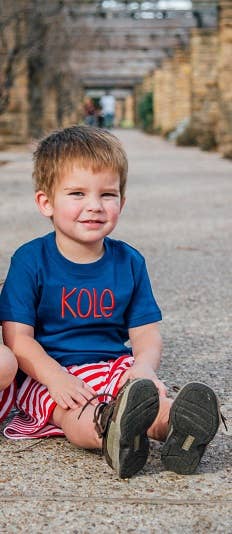 Navy blue 100% cotton short sleeve tee with double-stitched seams, flat lay