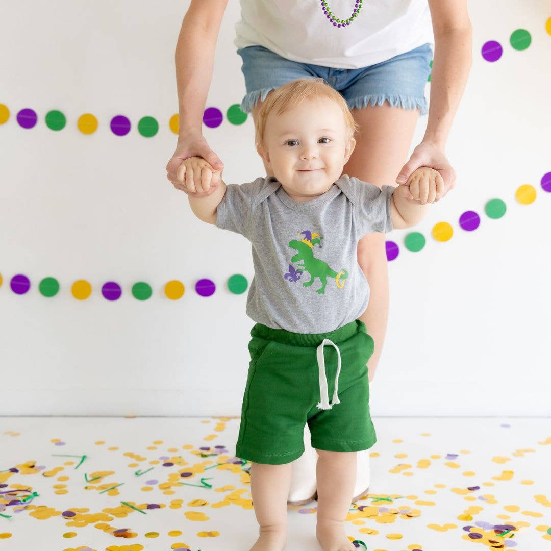 Heather gray short sleeve bodysuit with purple, green, and yellow Mardi Gras dinosaur graphic