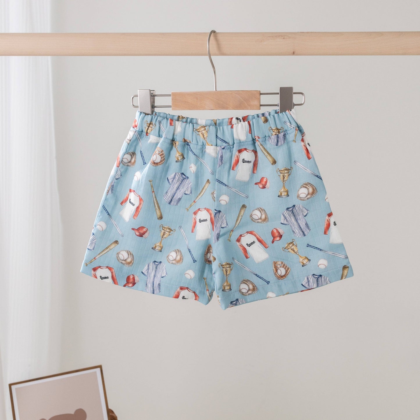 Let's Play Ball Organic Muslin Shorts in natural with baseball-inspired print by Nola Tawk