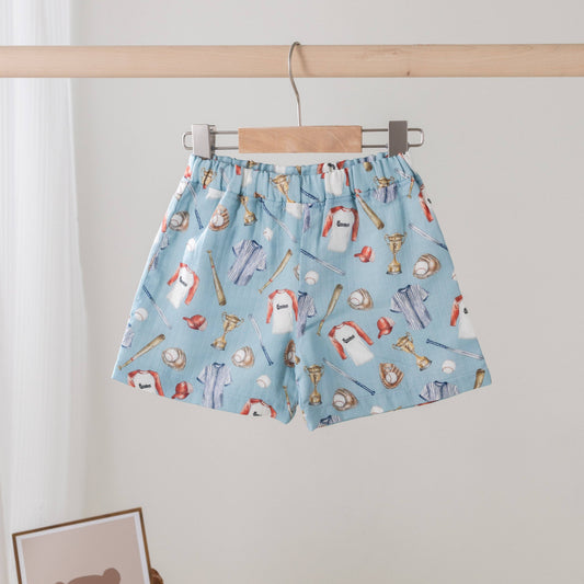 Let's Play Ball Organic Muslin Shorts in natural with baseball-inspired print by Nola Tawk