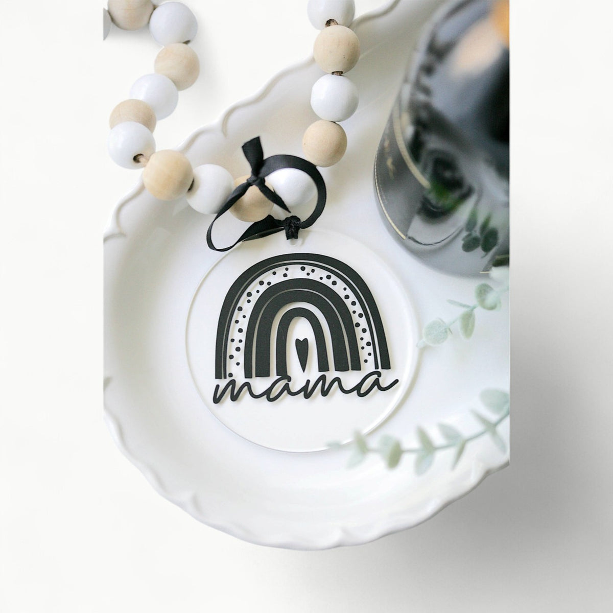 Rainbow Mama acrylic ornament by Younique, 4 inches, hanging from black ribbon