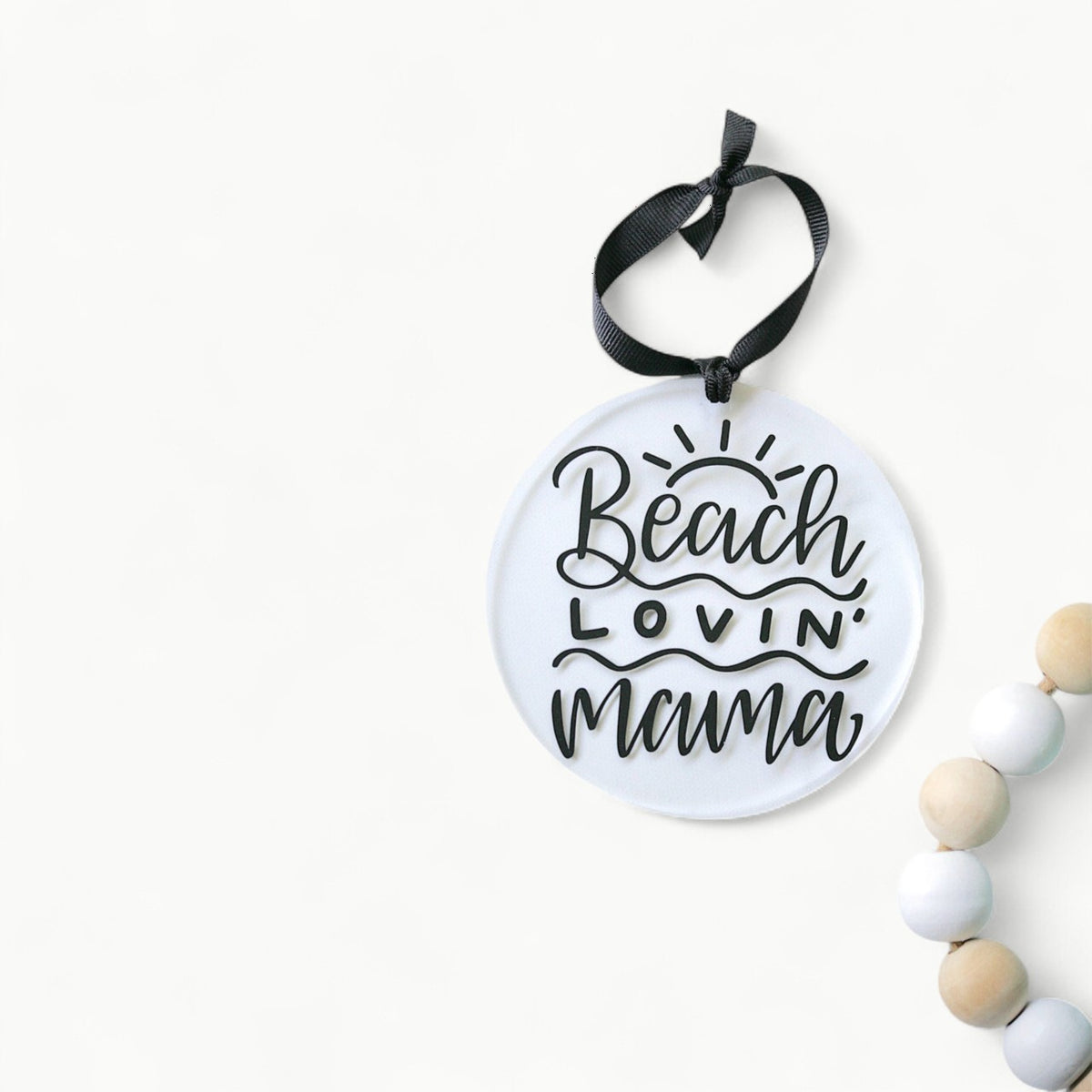 Beach Lovin Mama clear acrylic ornament by Younique, 4 inches, hanging from black ribbon