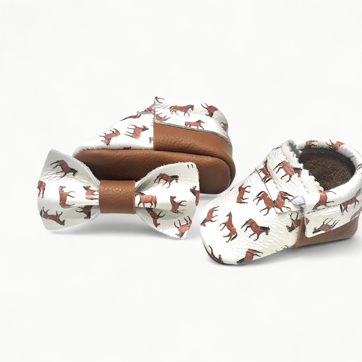 Ivory leather moccasins with subtle horse print, elastic band closure, Mishmoccs brand