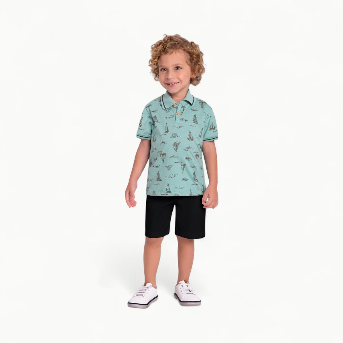 Aqua blue cotton polo with sailboat print, paired with black knit shorts