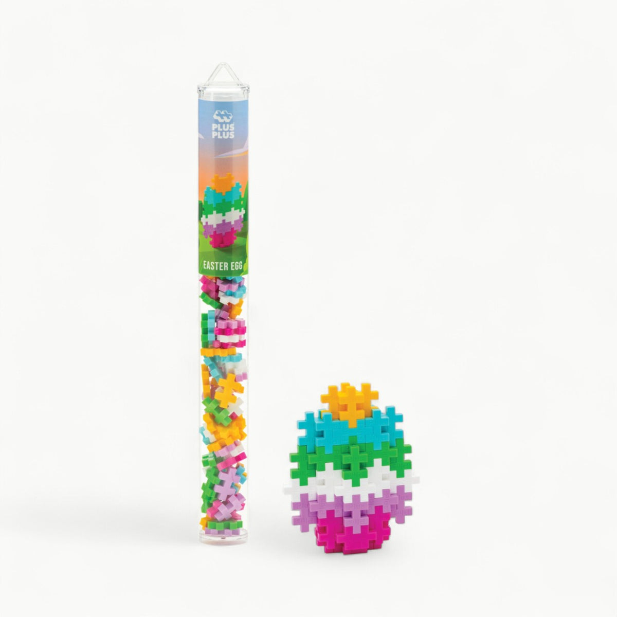 Plus-Plus Easter Egg tube containing 70 colorful building pieces in white, mustard, turquoise, apple, lilac, and fuchsia