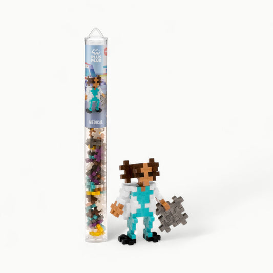 Plus-Plus Medical Tube 70 pc set with turquoise, white, yellow, and metallic pieces in reusable travel tube