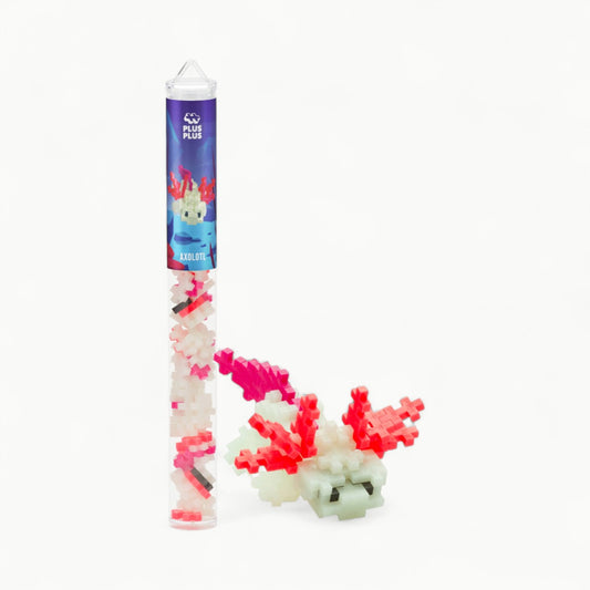 Plus-Plus Axolotl tube with 70 glow-in-the-dark pieces in Glow, Navy, Coral, and Fuchsia