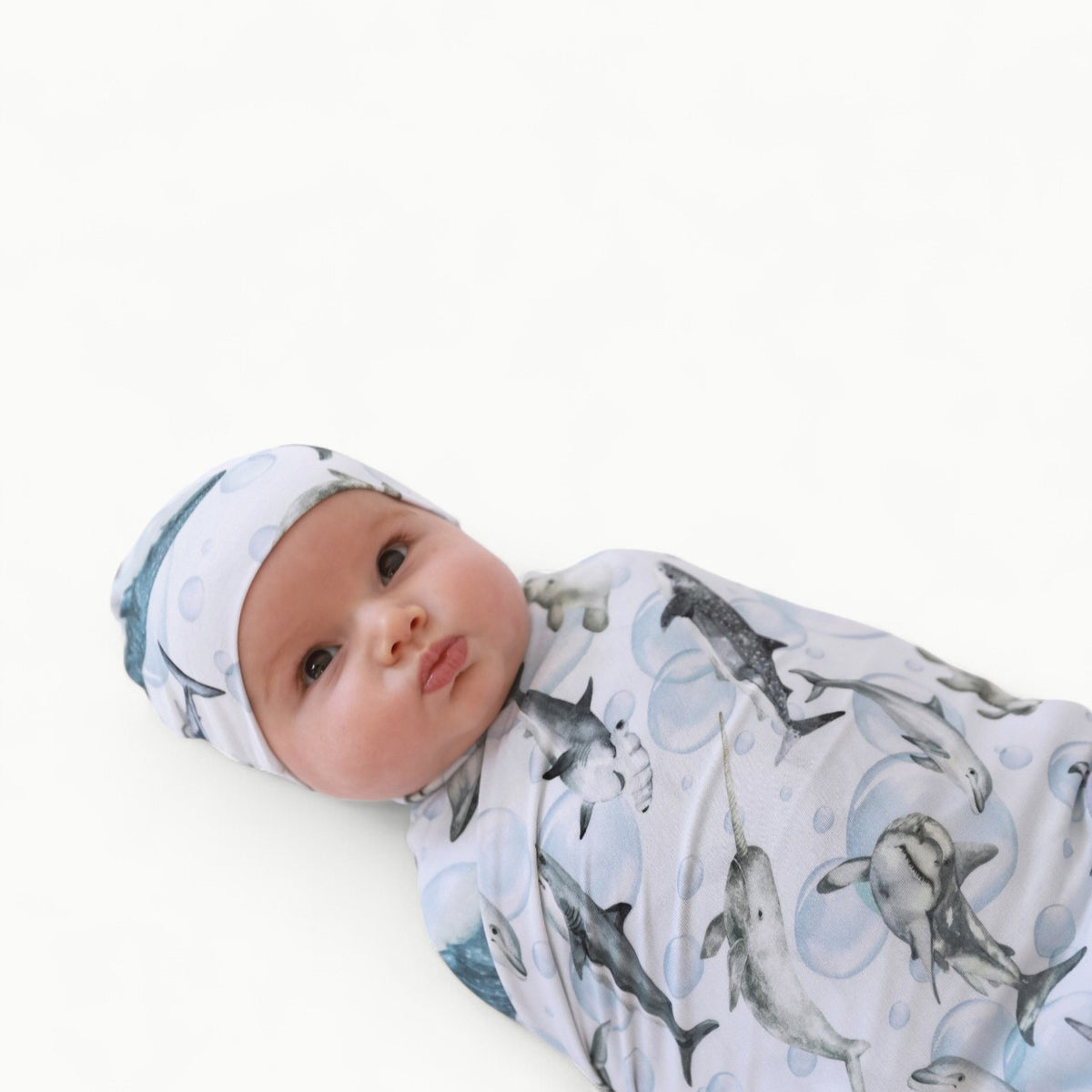 Posh Peanut Sharkly Swaddle and matching beanie in soft bamboo viscose, folded presentation