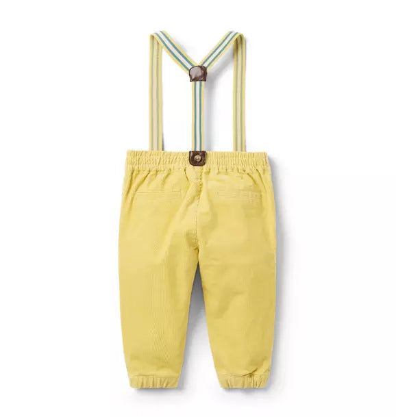 Yellow corduroy pants with attached striped suspenders and faux leather accents, button front closure