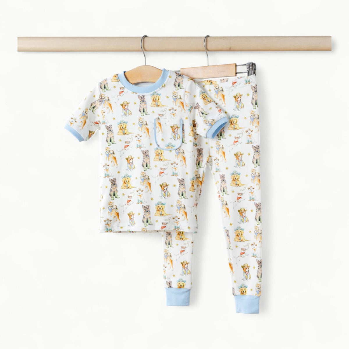 Cowboy Pups organic cotton pajama set in cream with Western-inspired print and ribbed cuffs