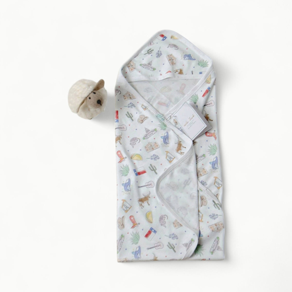 Nola Tawk organic cotton baby swaddle blanket, GOTS certified, folded elegantly