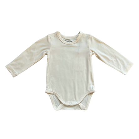 Cream long sleeve baby bodysuit by Baby Sprouts, 95% bamboo jersey with snap closures