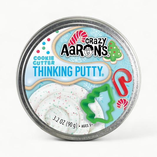 Cookie Cutter Thinking Putty in green and red glitter with two stainless steel cookie cutters