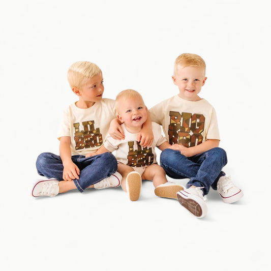 Natural heather short sleeve t-shirt with camo chenille patch and black outline