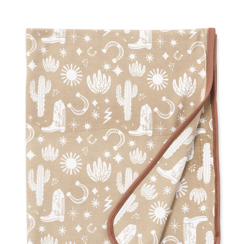 Beige Wild West Stroller Blanket with subtle cowboy rodeo print, 100% cotton by Tesa Babe