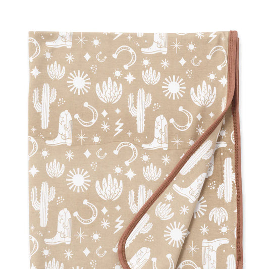 Beige Wild West Stroller Blanket with subtle cowboy rodeo print, 100% cotton by Tesa Babe