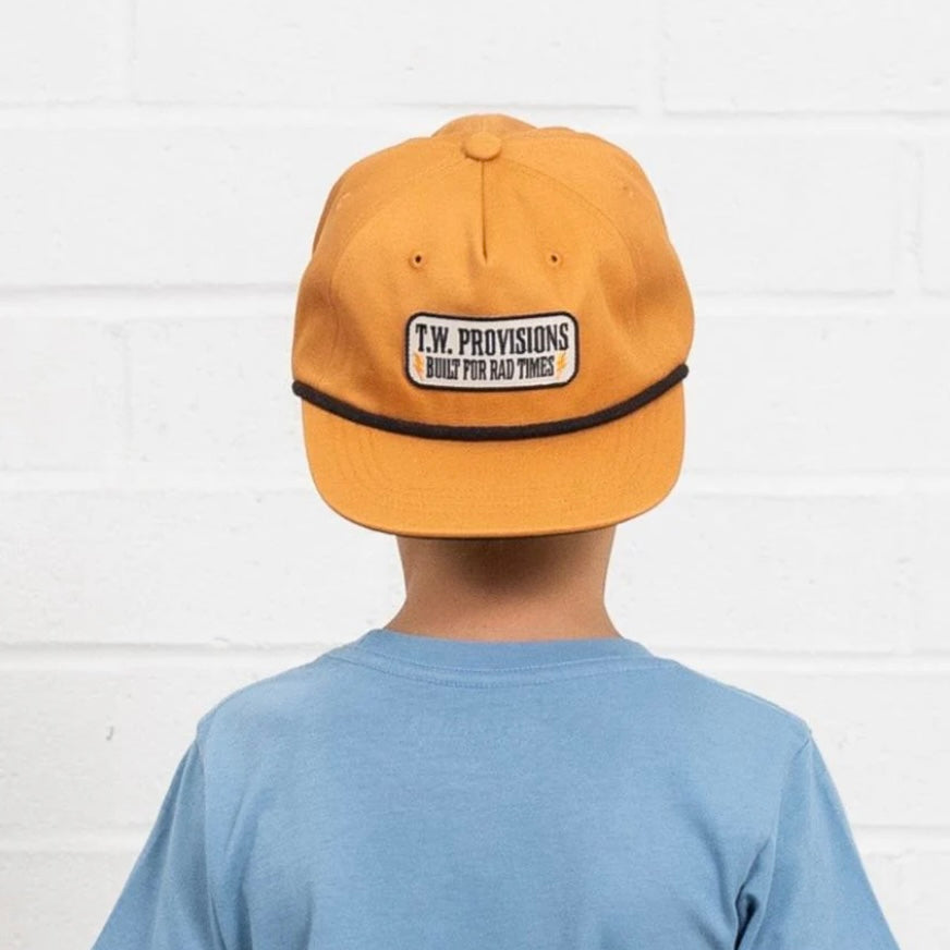 Structured rust cotton snapback hat with embroidered patch detail and adjustable snap back closure by Tiny Whales