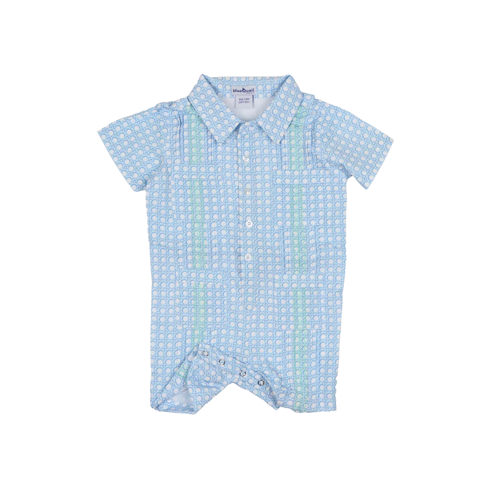 Blue Quail Guayabera romper with blue cane lattice embroidery detail and four pockets