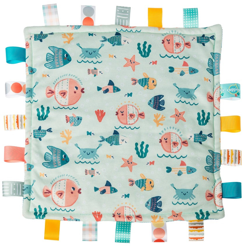 Taggies Original Comfy Fishies teether with patterned jersey front, plush backing, and looped ribbons.