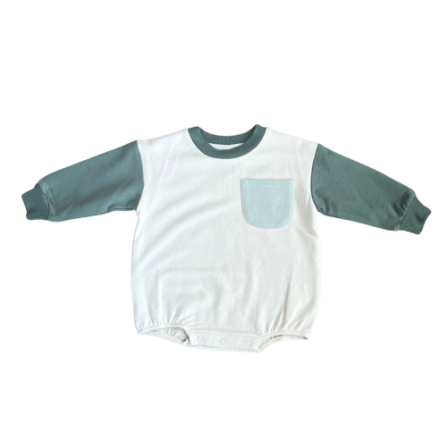Colorblock romper in pine by Baby Sprouts, featuring understated colorblock design