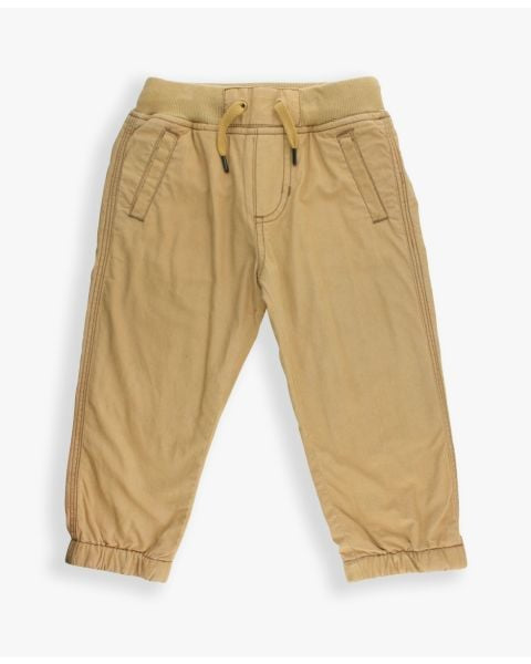 Dark khaki jogger pants with ruffle detail, soft and stretchy fabric for children