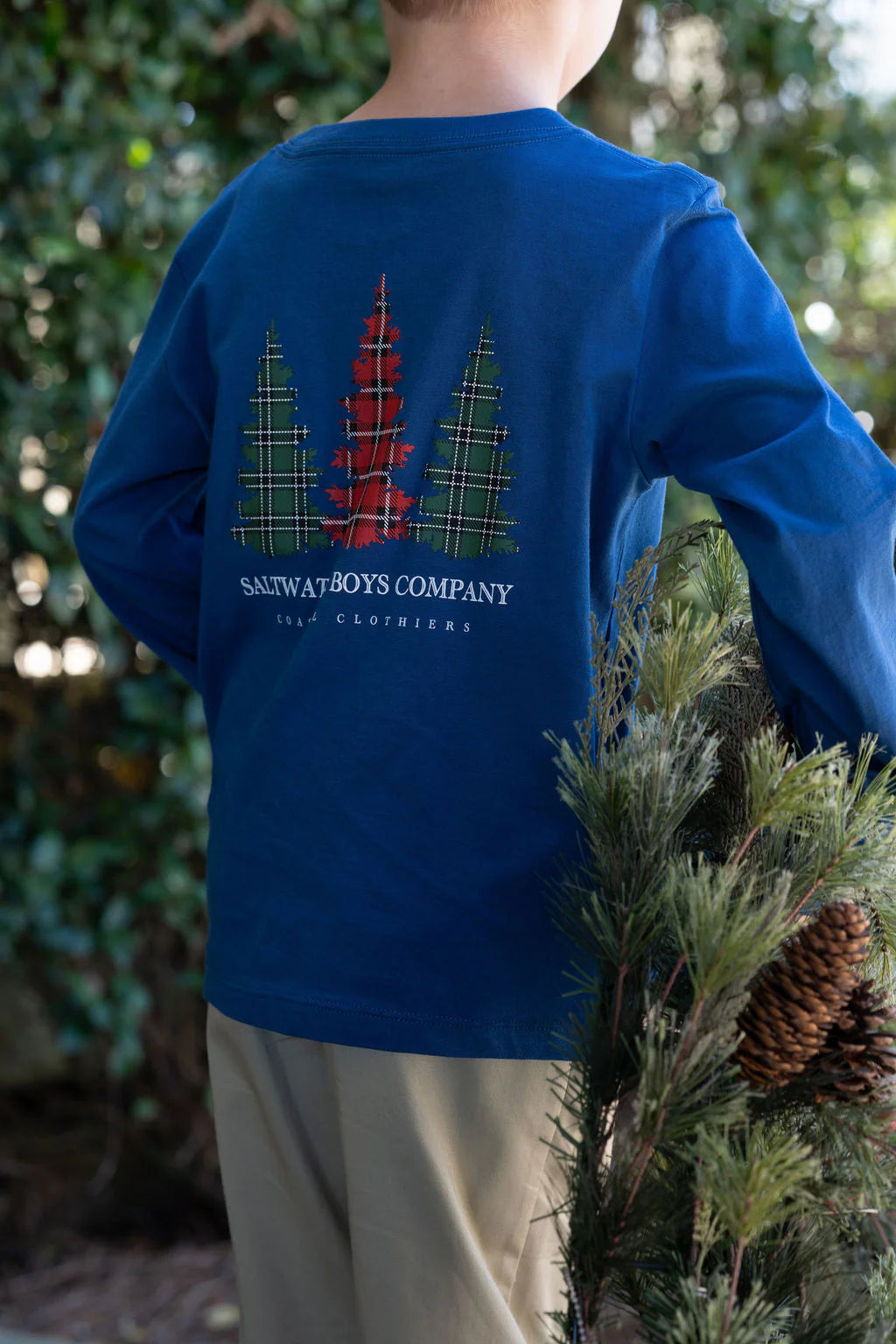 Green and red plaid Christmas tree graphic pocket tee in long-sleeve, cream base