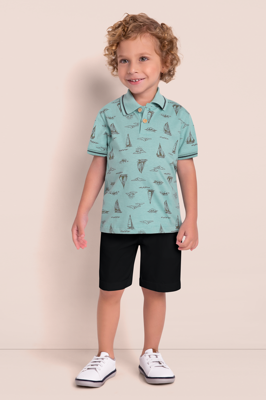 Aqua blue cotton polo with sailboat print, paired with black knit shorts