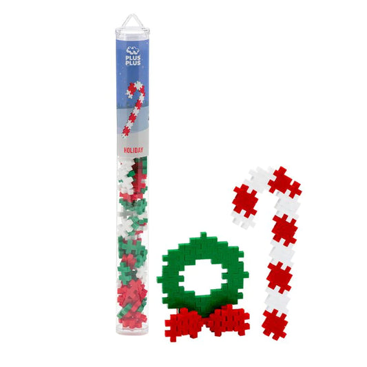 Plus-Plus Holiday Mix tube with 70 interlocking building pieces in white, red, and green