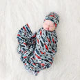 Posh Peanut Miles Swaddle and Beanie Set in blue, red, and black with race car design
