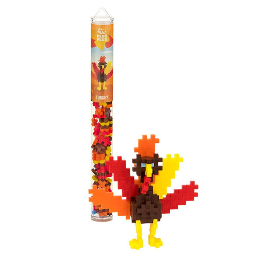 Plus-Plus Turkey tube with 70 connector pieces in red, orange, yellow, pastel blue, and brown