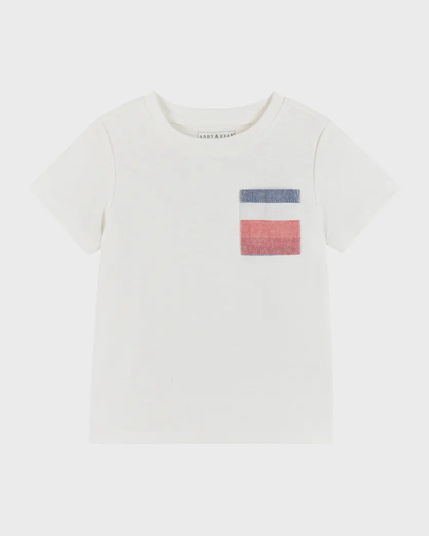 A white crew neck t-shirt with a red white and blue striped pocket detail. 