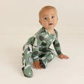 Posh Peanut Airman footed one-piece pajamas in neutral tone, featuring reversible zipper and grip-sole footies