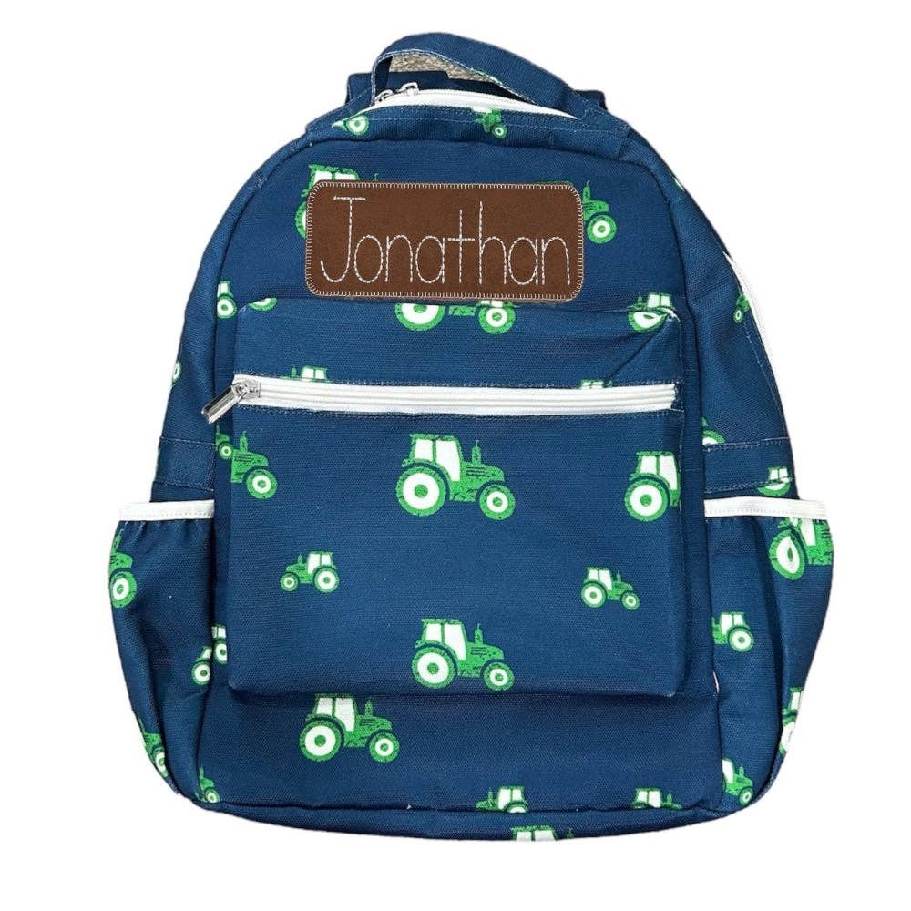 Navy boys' backpack with tractor design, exterior and interior pockets, 16x13x3.5 inches