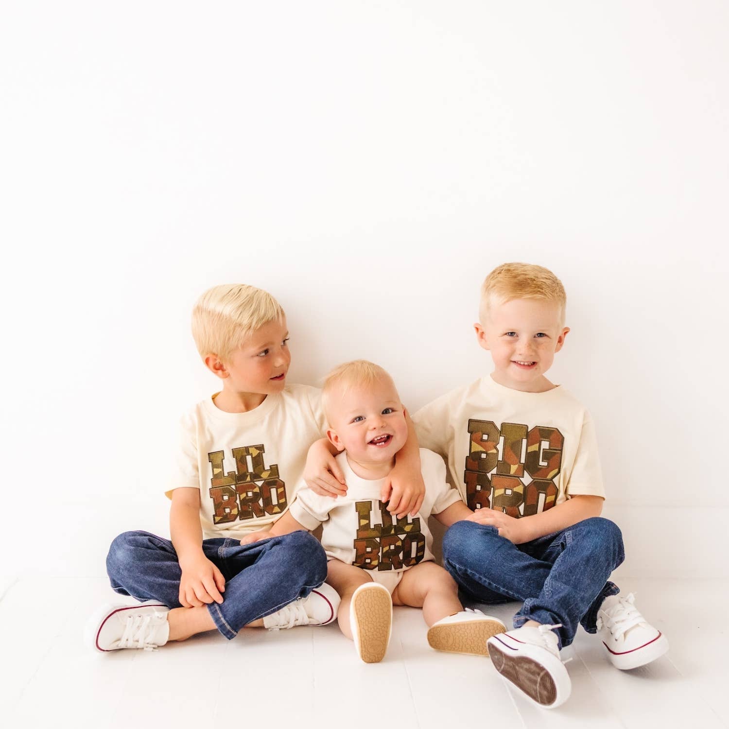 Natural heather short sleeve t-shirt with camo chenille patch and black outline