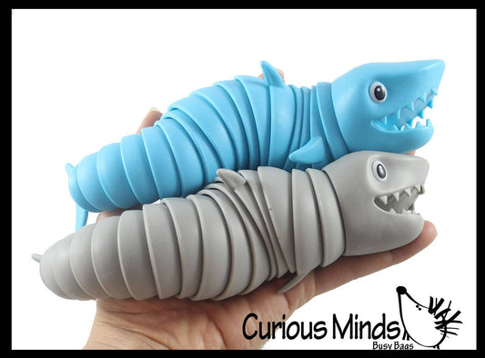 Articulated shark fidget toy with connected hard plastic segments in jointed design
