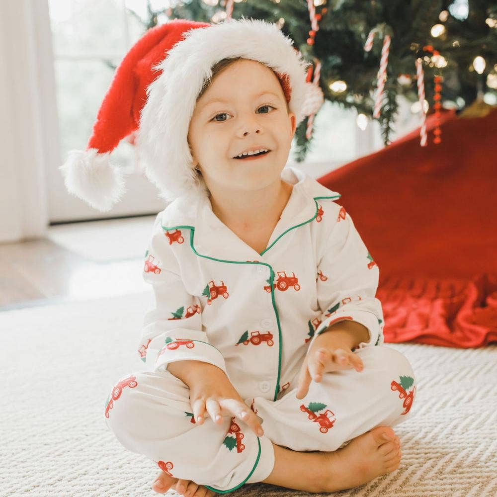 Christmas Tractors button-down pajamas in soft polyester blend; long-sleeve shirt and matching pants.