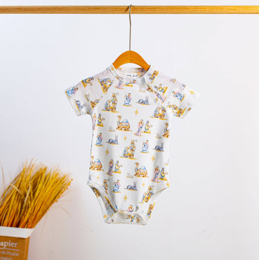 O Holy Night organic cotton onesie by Nola Tawk in natural cream, with shoulder and bottom snap closures