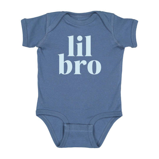Indigo short sleeve bodysuit with light blue graphic, tagless neck, and three-snap closure