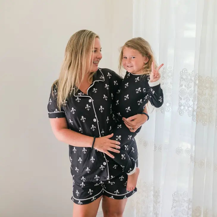 Black button-down pajamas with white fleur de lis pattern, elastic-waist shorts